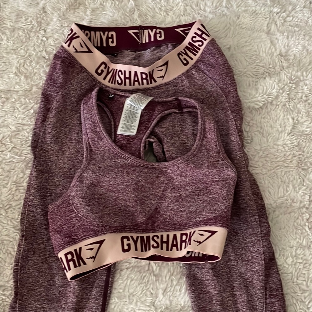 Small Gymshark flex sports bra and matching leggings color is a purple burgundy